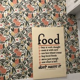 a sign on the wall of a restaurant