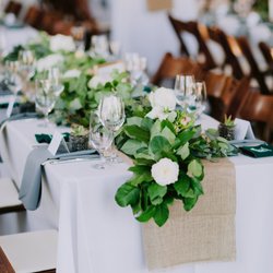 Sydney Camille Events - Wedding table setting with garland, succulent favors, koozies