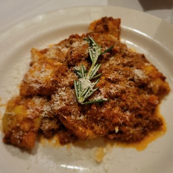 Gene & Georgetti - Tordelli Lucchesi - house-made pasta filled with a blend of beef, pork, and herbs. Served with bolognese sauce - Italian Near Me - Chicago, Illinois Gene & Georgetti - Tordelli Lucchesi - house-made pasta filled with a blend of beef, pork, and herbs. Served with bolognese sauce - Italian Near Me - Chicago, Illinois