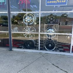 Detroit Goodyear Supercenter - Bullets holes in the front window of the shop