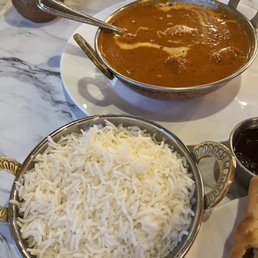 a plate of rice and a bowl of curry a plate of rice and a bowl of curry