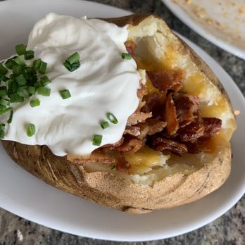 Ruth's Chris Steak House - Loaded baked potato - Steakhouses Near Me - Ponte Vedra Beach, Florida Ruth's Chris Steak House - Loaded baked potato - Steakhouses Near Me - Ponte Vedra Beach, Florida