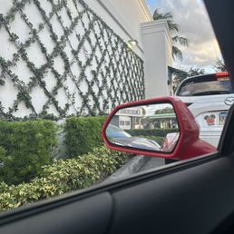 a view of a starbucks sign through a car window a view of a starbucks sign through a car window
