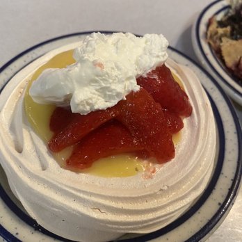 Idle Isle Cafe - Pavlova with lemon curd, strawberries and added whip cream. - American Near Me - Brigham City, Utah
