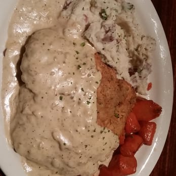 Charleston's - Chicken fried steak with Chipotle gravy. Savory garlicky mash potatoes. And some yummy yummy sweet carrots. - American Near Me - Fort Worth, Texas