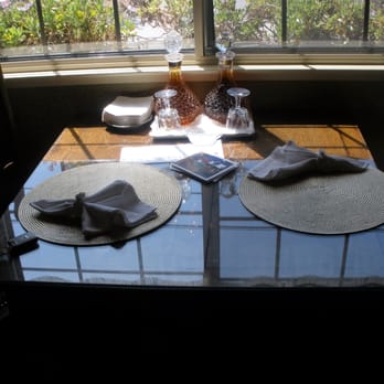 Mill Rose Inn - Mill Rose Inn, Half Moon Bay, CA - wonderful seating area for breakfast and snacks, brandy and sherry in background - Hotels Near Me - Half Moon Bay, California