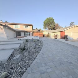 Pacific Landscaping and Maintenance - Paver driveway next to concrete walkway. New wall and complete landscape. El Cajon.