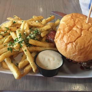 Photo of Crave Real Burgers - Denver, CO, United States. Love Stinks burger with garlic parmesan fries