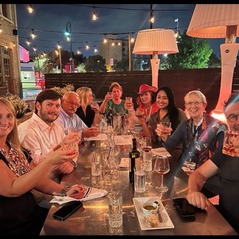 Battalion - Friends having an after dinner drink together on the Battalion patio, perfect night. - Italian Near Me - San Antonio, Texas