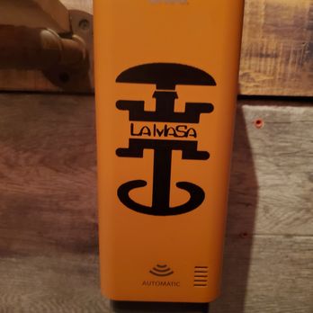 La Masa - a yellow box with a black logo - Cocktail Bars Near Me - The Bronx, New York La Masa - a yellow box with a black logo - Cocktail Bars Near Me - The Bronx, New York