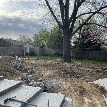 3ALandscapes - a backyard with steps leading to a patio - Irrigation Near Me 3ALandscapes - a backyard with steps leading to a patio - Irrigation Near Me