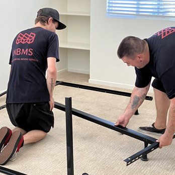 New Beginnings Moving Solutions - Kyle and Derek assembling a bed frame - Movers Near Me New Beginnings Moving Solutions - Kyle and Derek assembling a bed frame - Movers Near Me