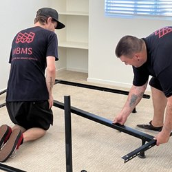 New Beginnings Moving Solutions - Kyle and Derek assembling a bed frame
