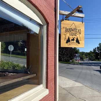Arrowhead Lodge - a sign in the window - Bars Near Me - Milton, Vermont