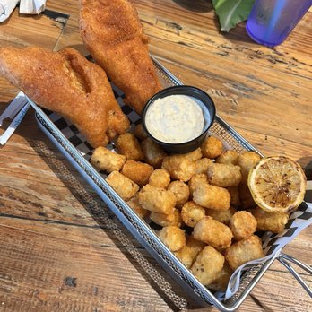 The Back Porch - Haddock Fish and chips with tater tots. Very good! - Burgers Near Me - Longwood, Florida The Back Porch - Haddock Fish and chips with tater tots. Very good! - Burgers Near Me - Longwood, Florida