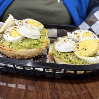 The Bagel Lady - Open-faced avocado toast on an everything bagel topped with a hard boiled egg - Bagels Near Me - Rockwall, Texas