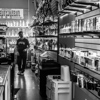 Great Smoke - a man standing in a store - Hookah Bars Near Me - Atlanta, Georgia Great Smoke - a man standing in a store - Hookah Bars Near Me - Atlanta, Georgia