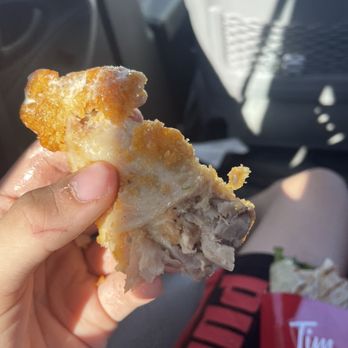 Tim Hortons - a hand holding a half eaten donut - Coffee & Tea Near Me - St Albert, Alberta Tim Hortons - a hand holding a half eaten donut - Coffee & Tea Near Me - St Albert, Alberta