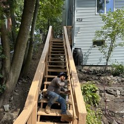 Deyvins Construction - Added handrail to step, and painted it after painting the stairs and bigger railing.