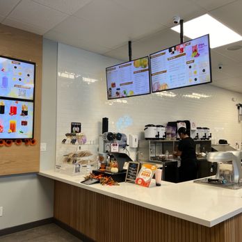 RareTea - a restaurant counter with a menu on the wall - Bubble Tea Near Me - Hemet, California