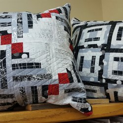 Quilter's Quarters - Log Cabins can be scrappy or planned! Ask us about a class.