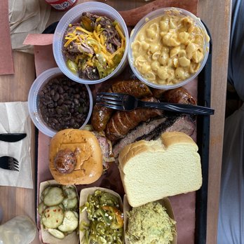 la Barbecue - Regular sausage, jalapeño cheddar sausage, shells and cheese, potato salad, pickles and jalapeños, beans, frito pie, El Sancho Loco - Barbeque Near Me - Austin, Texas la Barbecue - Regular sausage, jalapeño cheddar sausage, shells and cheese, potato salad, pickles and jalapeños, beans, frito pie, El Sancho Loco - Barbeque Near Me - Austin, Texas