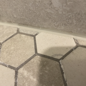 Bath Fixer of La Crosse - The white that can be seen around the tile is mortar, not soap scum or residue - General Contractors Near Me - La Crosse, Wisconsin