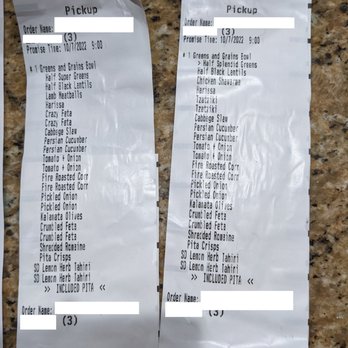 CAVA - a receipt and a receipt on a counter - Mediterranean Near Me - Gaithersburg, Maryland