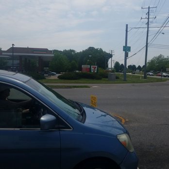 7-Eleven - a blue car parked in a parking lot - Convenience Stores Near Me - Virginia Beach, Virginia