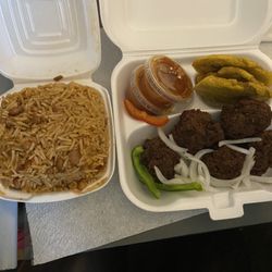 Au Bon Gout Restaurant - Rice and beans with fried meatballs and a side of fried plantains