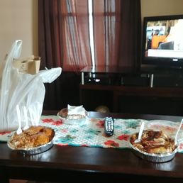 two pies on a table in front of a television
