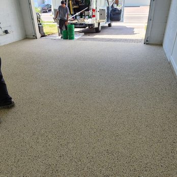 GarageExperts of Brevard - a man in a garage - Flooring Near Me - Melbourne, Florida GarageExperts of Brevard - a man in a garage - Flooring Near Me - Melbourne, Florida