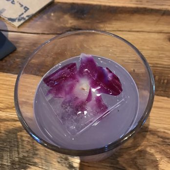 Boca - Such a pretty cocktail with an orchid in the ice cube. Yummy too...Fly Dye - New American Near Me - Sarasota, Florida