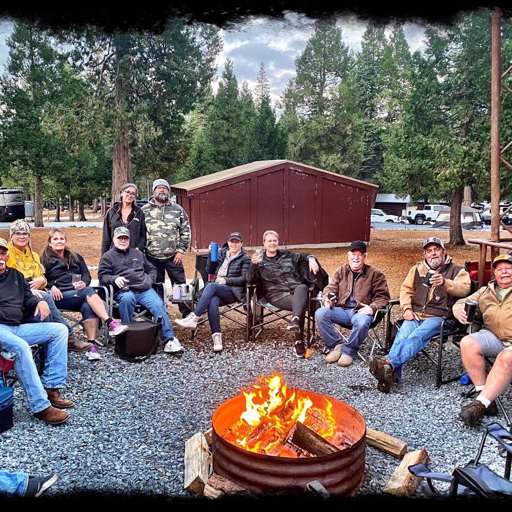 Robbs Resort - a group of people sitting around a fire pit - Campgrounds Near Me - Pollock Pines, California Robbs Resort - a group of people sitting around a fire pit - Campgrounds Near Me - Pollock Pines, California