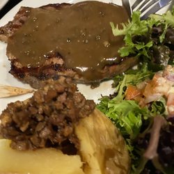 Norman Hotel - Steak with pepper sauce, salad, baked potato.