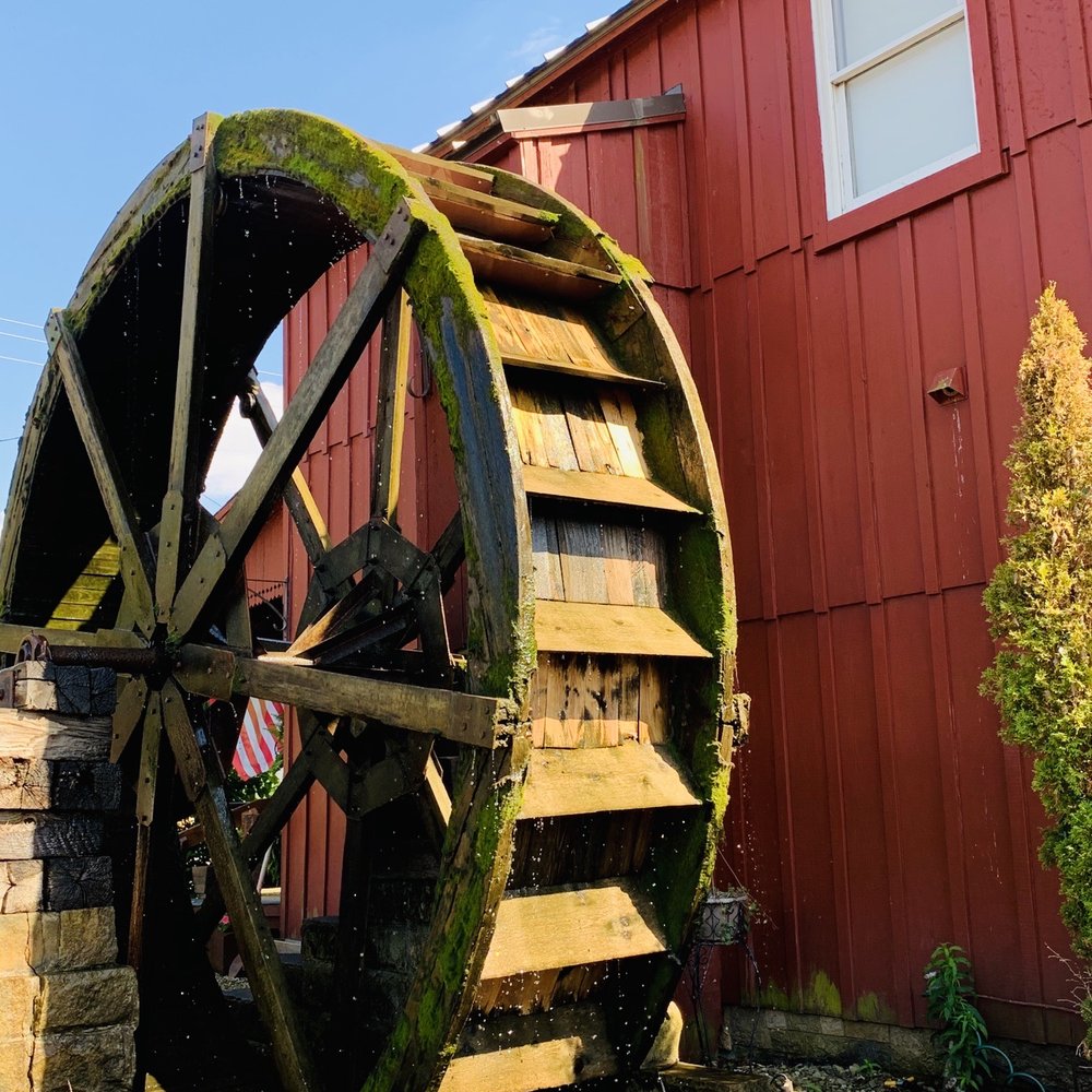 The Wine Mill - a water wheel in front of a red building - Wine Bars Near Me - Peninsula, Ohio The Wine Mill - a water wheel in front of a red building - Wine Bars Near Me - Peninsula, Ohio