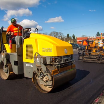 Washington State Paving - a worker working on a road - General Contractors Near Me Washington State Paving - a worker working on a road - General Contractors Near Me