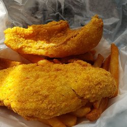 Sharks Fish and Chicken - I guess they thought it was acceptable to charge me for a two piece but receive 1 1/2 piece perch dinner. The upper piece is a half piece!