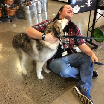 Mud Bay - Staff member Mark getting some love! just another day in Mud Bay! - Pet Stores Near Me - Lynnwood, Washington