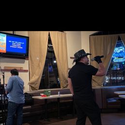 a man holding a baseball bat a man holding a baseball bat