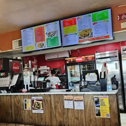 Nicos Mexican Food - Front counter with menu board