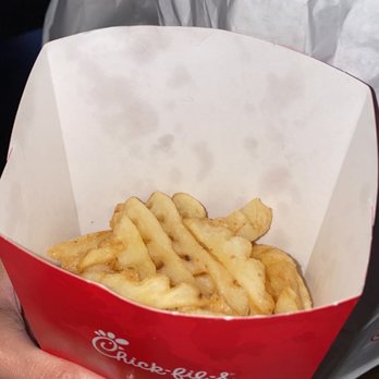 Chick-fil-A - ows a person holding a basket of french fries - Fast Food Near Me - Pearland, Texas