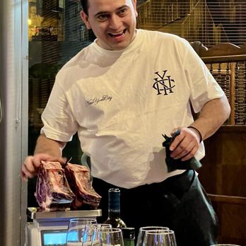 La Taska De Isozaki - The owner weighs our cuts of beef - Wine Bars Near Me - Bilbo, BI