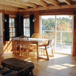 Harborfields Cottages - Living room of the Deck Cottage at Harborfields. It features a second-story master bedroom with modern en suite bathroom and great views!