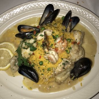 Tavira Restaurant - Tamboril na Cataplana. Roasted Monkfish with Shrimp and Mussels. - Mediterranean Near Me - Chevy Chase, Maryland Tavira Restaurant - Tamboril na Cataplana. Roasted Monkfish with Shrimp and Mussels. - Mediterranean Near Me - Chevy Chase, Maryland