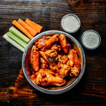 Straight From New York Pizza - a bowl of buffalo wings and carrots - Pizza Near Me - Salem, Oregon Straight From New York Pizza - a bowl of buffalo wings and carrots - Pizza Near Me - Salem, Oregon