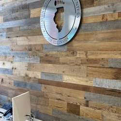 Advanced Foot and Ankle Centers of Illinois - Aurora - Metal Advanced Foot & Ankle Centers of Illinois logo hanging on wall