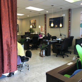 MKJ Nails - Pedicure stations behind the curtain to the left and 3 rows of nail stations. - Waxing Near Me - Hilliard, Ohio