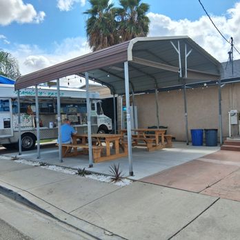 Ramon's Tacos - Benches, a car awning, and bathrooms in the vacant building. - Mexican Near Me - Planada, California
