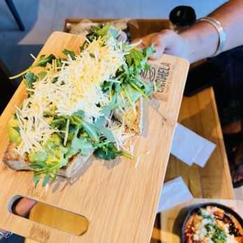Carmela Coffee - Parkland - Arugula Parmesan Avocado Toast* - Coffee & Tea Near Me - Parkland, Florida